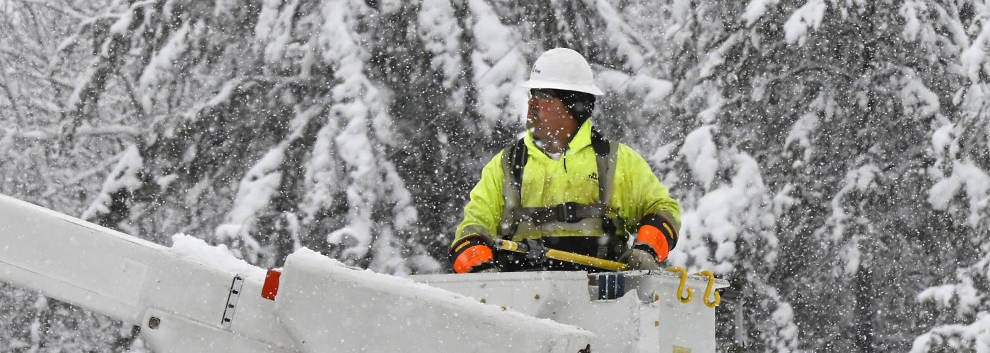 Linemen restoring power in a winter storm. 